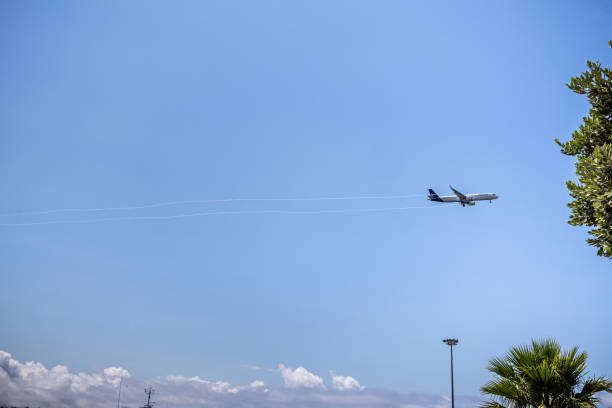 Airbus from Lufthansa pulling vapor tracks during landing in the wet air in the Portuguese city Ponta Delgada on the Azorean island San Miguel