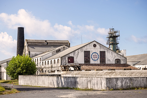 Old abandoned sugar factory in the Portuguese city Ponta Delgada on the Azorean island San Miguel