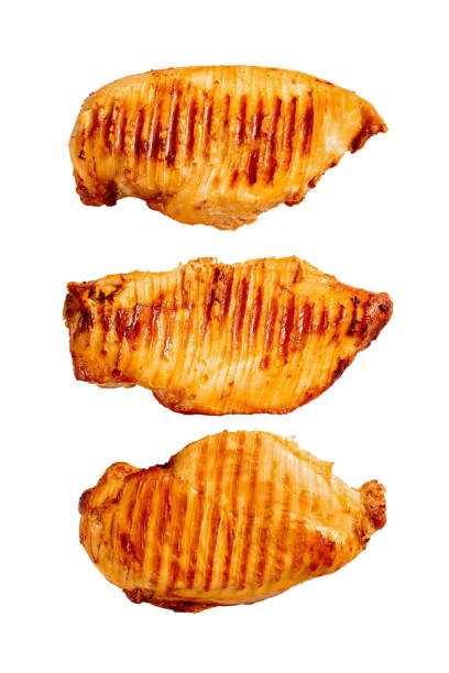 istock three whole grilled chicken breasts isolated on white background 1339695455