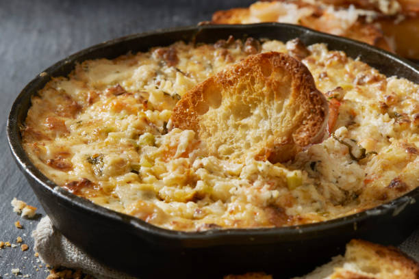 Cheesy Baked  Shrimp Dip with Toasted Crostini's Cheesy Baked  Shrimp Dip with Toasted Crostini's cheese dip stock pictures, royalty-free photos & images