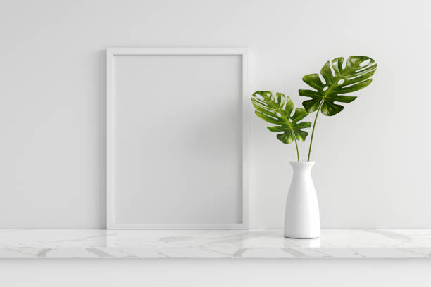 istock Monstera plant in vase with frame mockup, 3D rendering 1339704827