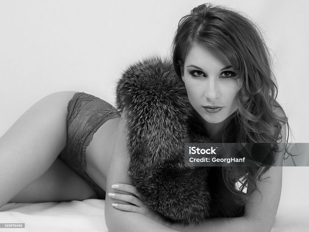 young Woman Beautiful young woman with an artificial fur. Black And White Stock Photo