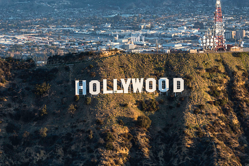 Los Angeles, California, USA - February 20, 2018:  Morning aerial view of the famous Hollywood Sign in Griffith Park with Burbank in background.