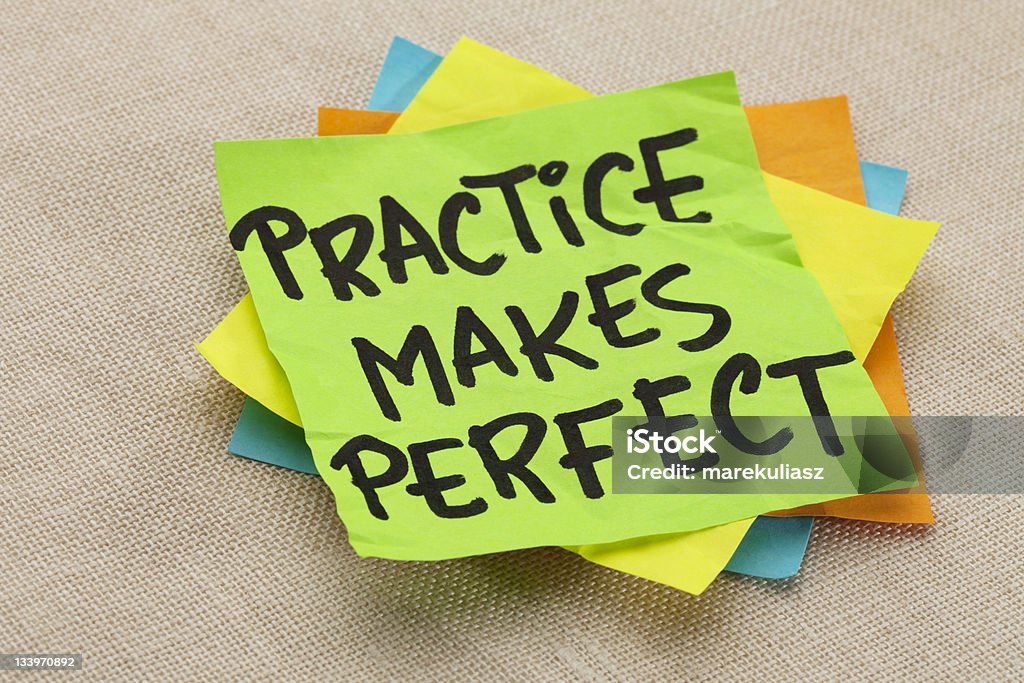 practice makes perfect practice makes perfect - a motivational slogan on a green stocky note Practicing Stock Photo