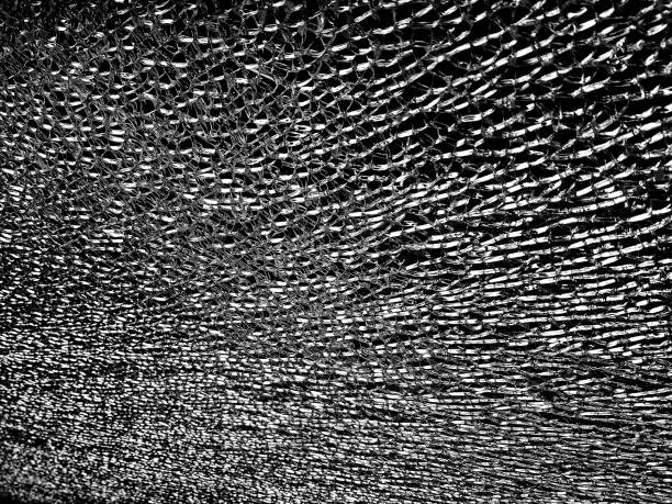 istock Close up of broken cracked glass. 1339713530