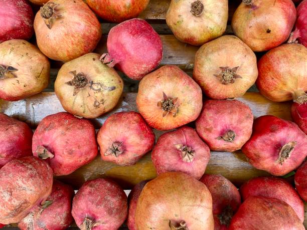 istock many pomegranates and pomegranate fruits 1339713845