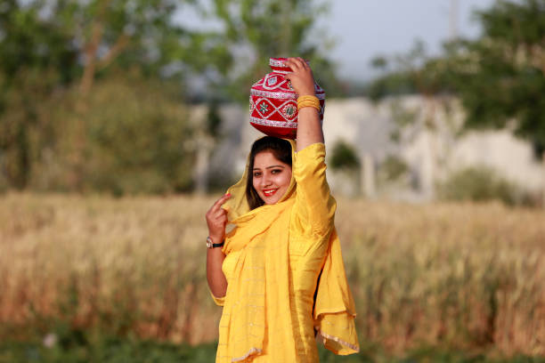 istock Pretty lady holding mud pot portrait outdoor 1339716618