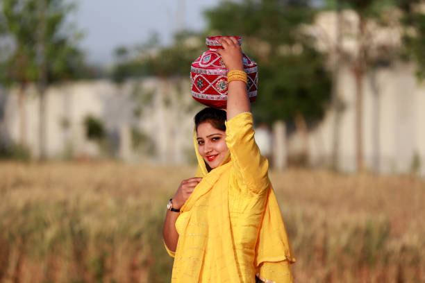 istock Pretty lady holding mud pot portrait outdoor 1339716625