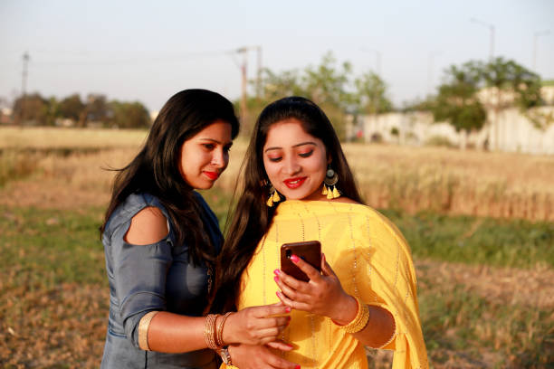 istock Pretty lady taking selfie using smart phone 1339716642
