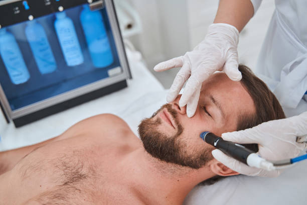 istock Man undergoing a facial skin cleansing procedure 1339725436