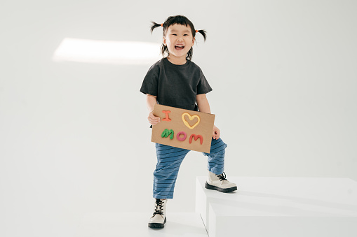Studio portrait of Asian toddler girl