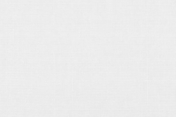 istock Blended cotton silk fabric textile wallpaper detailed texture pattern background in light white 1339739046