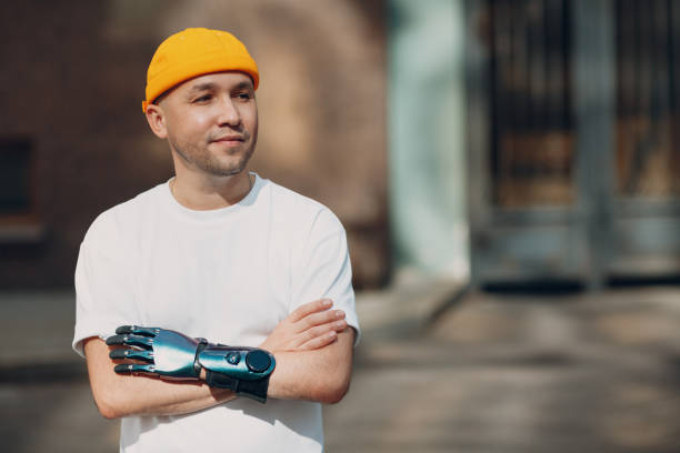 istock Young disabled man with artificial prosthetic hand in casual clothes. 1339739129