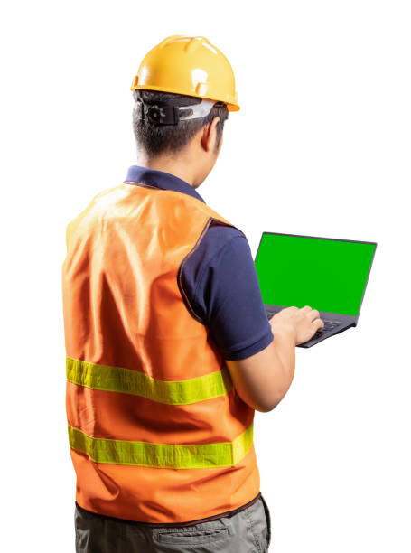 istock Asian engineer or technician wear helmet and vest hold computer notebook 1339739183
