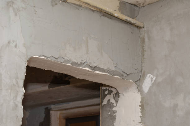 istock Repair and construction services concept. Gray plastered walls a 1339739711