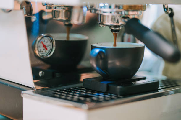 istock close up coffee machine dripping making cappuccino 1339743816