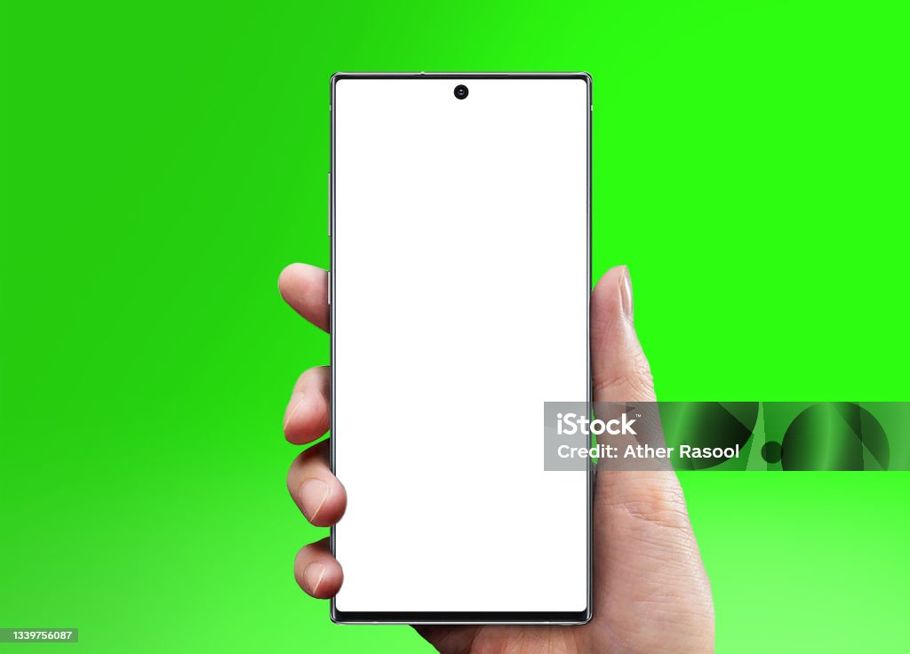 Galaxy Note10 in Hand with green background Galaxy Stock Photo