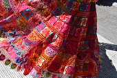 close up textile pattern of a skirt of a typical mexican costume worn by a woman during a dance
