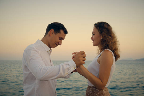 istock Man and woman holding hands 1339763265