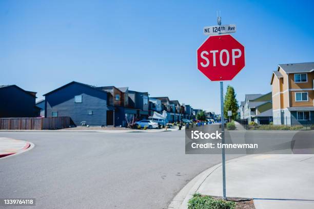 Stop Sign In Residential Neighborhood Stock Photo - Download Image Now - Stop Sign, Street, Car