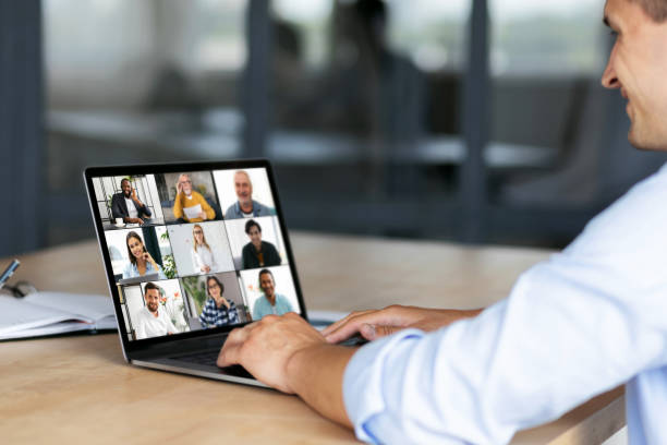 istock Group brainstorm concept, Caucasian employee uses laptop computer for online meeting with diverse multiracial colleagues sitting at the workplace 1339771433