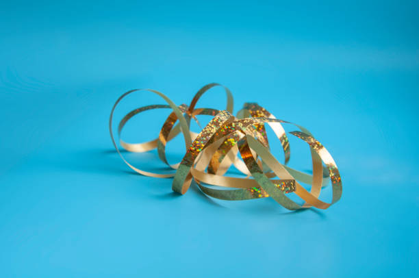 istock party ribbon confetti on blue 1339779642