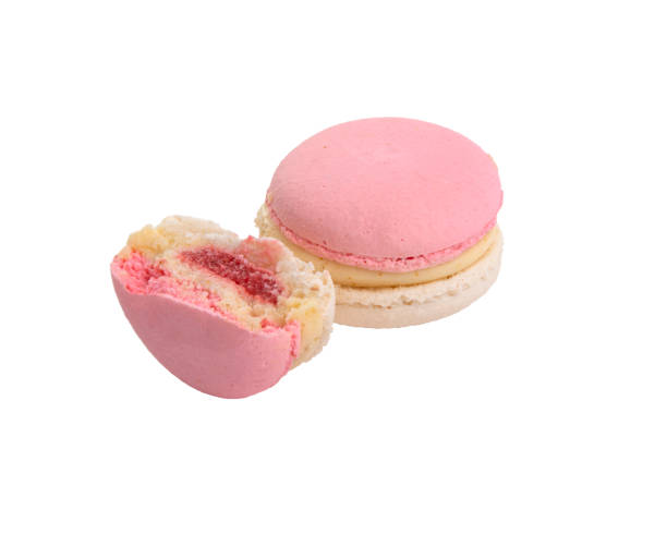 istock Exclusive pink macaroons eaten isolated on the white 1339781054