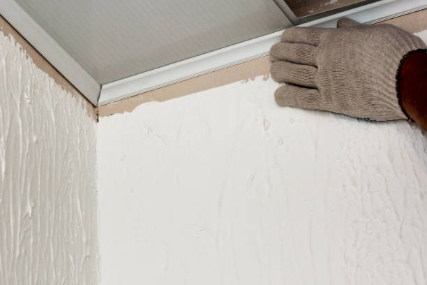 istock Installation of the side skirting board on the panel. 1339784312