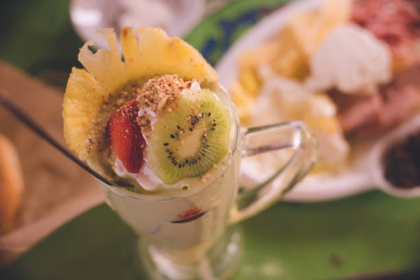 Avocado smoothie with fruit toppings at a diner