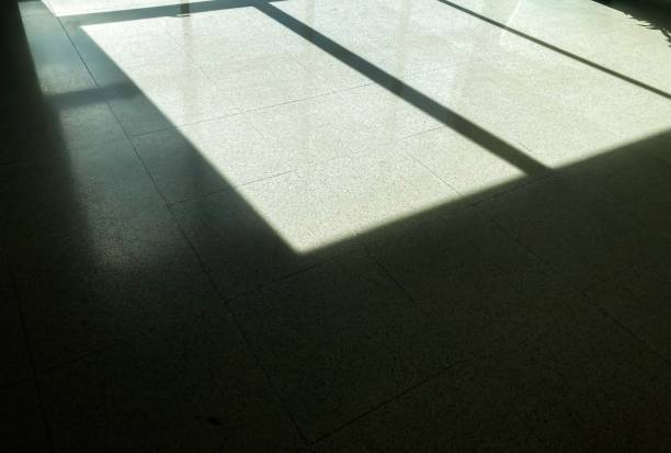 istock Shadows of sunlight shining from a large mirror. 1339794482