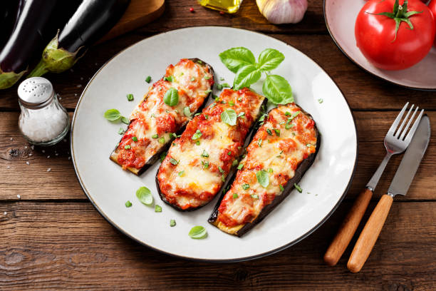 baked eggplant with mozzarella cheese - eggplant cheese mozzarella italian cuisine imagens e fotografias de stock