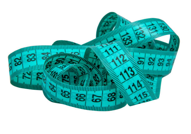 istock Blue rubber tape measure for sewing cloth or fabric isolated on the white 1339796490