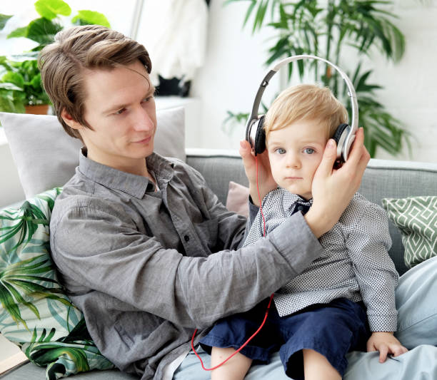 istock young father holds his little son in his arms 1339801121