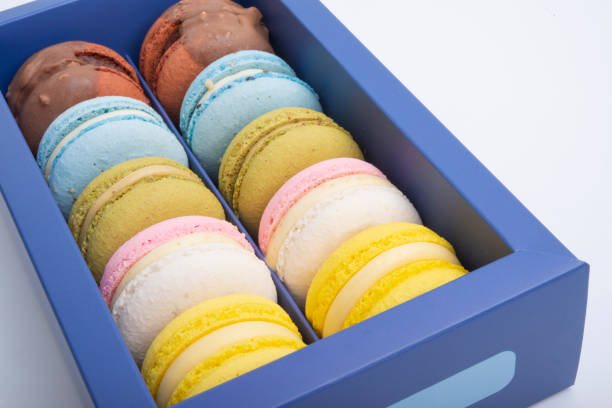 istock Exclusive macaroons in blue box isolated on the white 1339802351