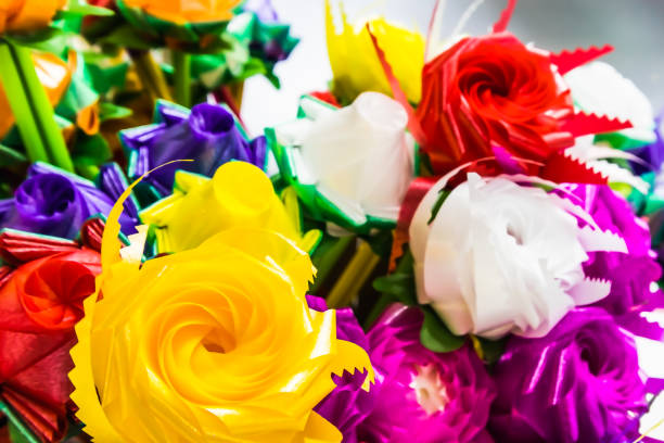 istock Artificial colorful roses handmade flowers isolated on background 1339802650