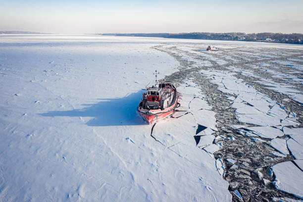 istock Icebreakers on river in winter. Aerial view of frozen river. 1339805167
