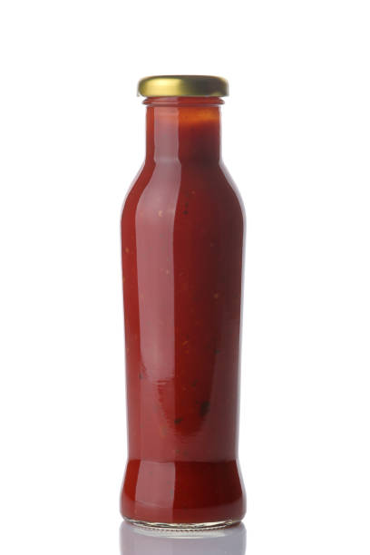 istock Red sauce in a bottle on a white isolated background. Tomato sauce. Ketchup 1339807247