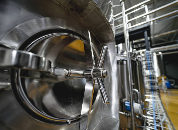 istock Craft beer brewing equipment in privat brewery 1339808198