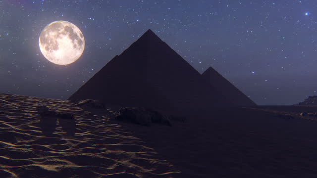 Pyramids at night with moon