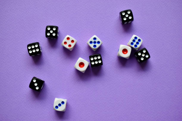 istock Dice  are black and white on a purple background 1339809563