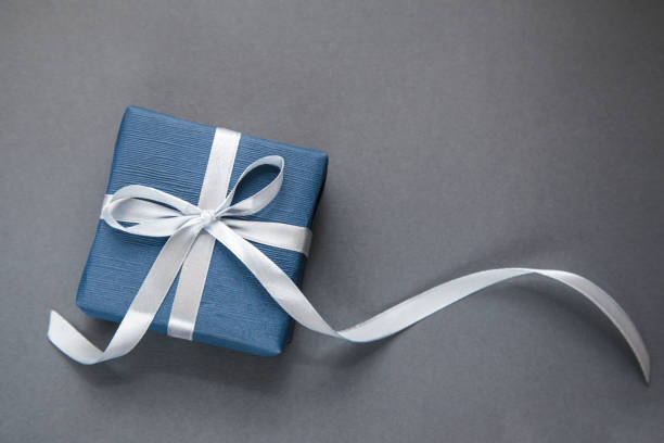 istock Dark Blue Gift box on grey background. Gift for men. Fathers day. Present for him. 1339809683