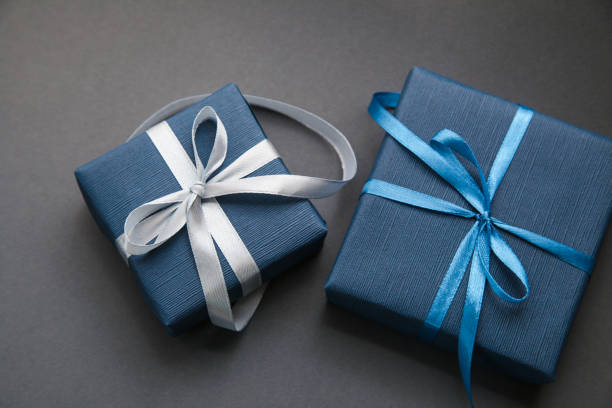 Two Dark Blue Gift box on grey background. Gift for men. Fathers day. Present for him.