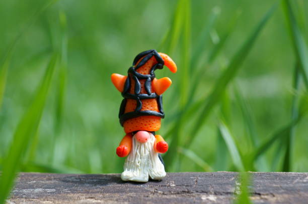 istock A figure of a dwarf with an orange striped hat. 1339813839
