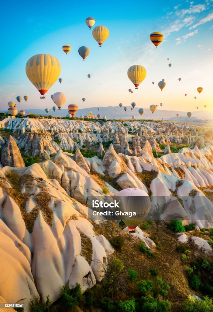 Air balloons flying Hot air balloons flying over Cappadocia, Turkey Cappadocia Stock Photo