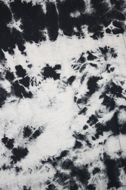 istock Tie dye black and white background with half circle layers fading from black to white monochrome dye fabric textile 1339815776