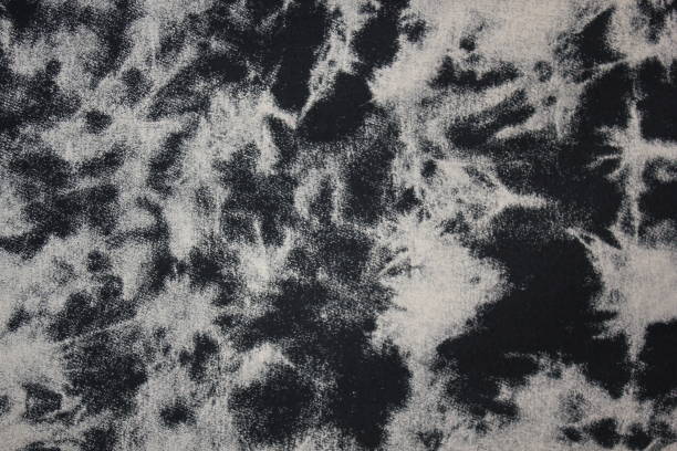 istock Tie dye black and white background with half circle layers fading from black to white monochrome dye fabric textile 1339816414