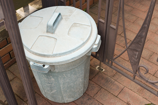 A plastic dustbin is put.