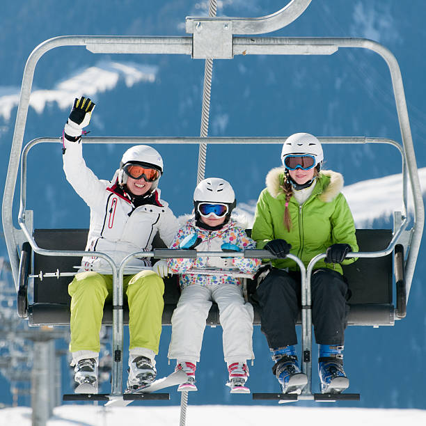 istock Three skiers riding a ski lift 133981773