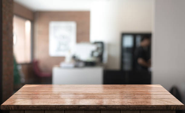 istock Empty wooden table top with lights bokeh on blur restaurant background. 1339819655