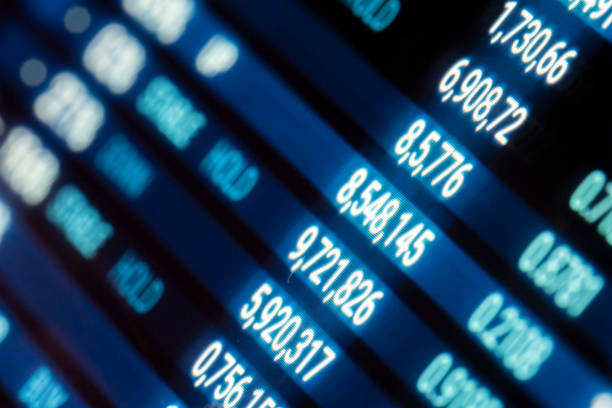 istock Computer screen showing green rising stock exchange information. 1339821978